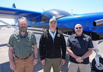 staff outside of the plane