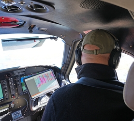 Biologist during a waterfowl survey in plane