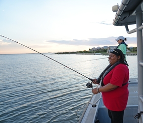 Woman fishing on the boat