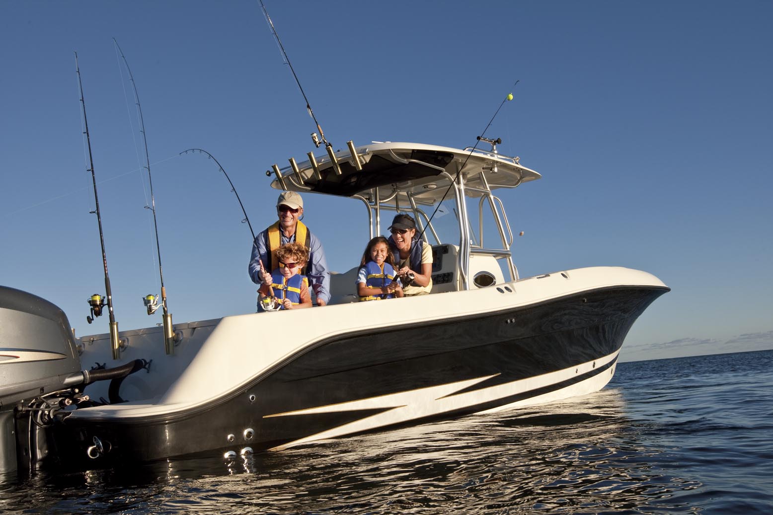 family fishing on their boat