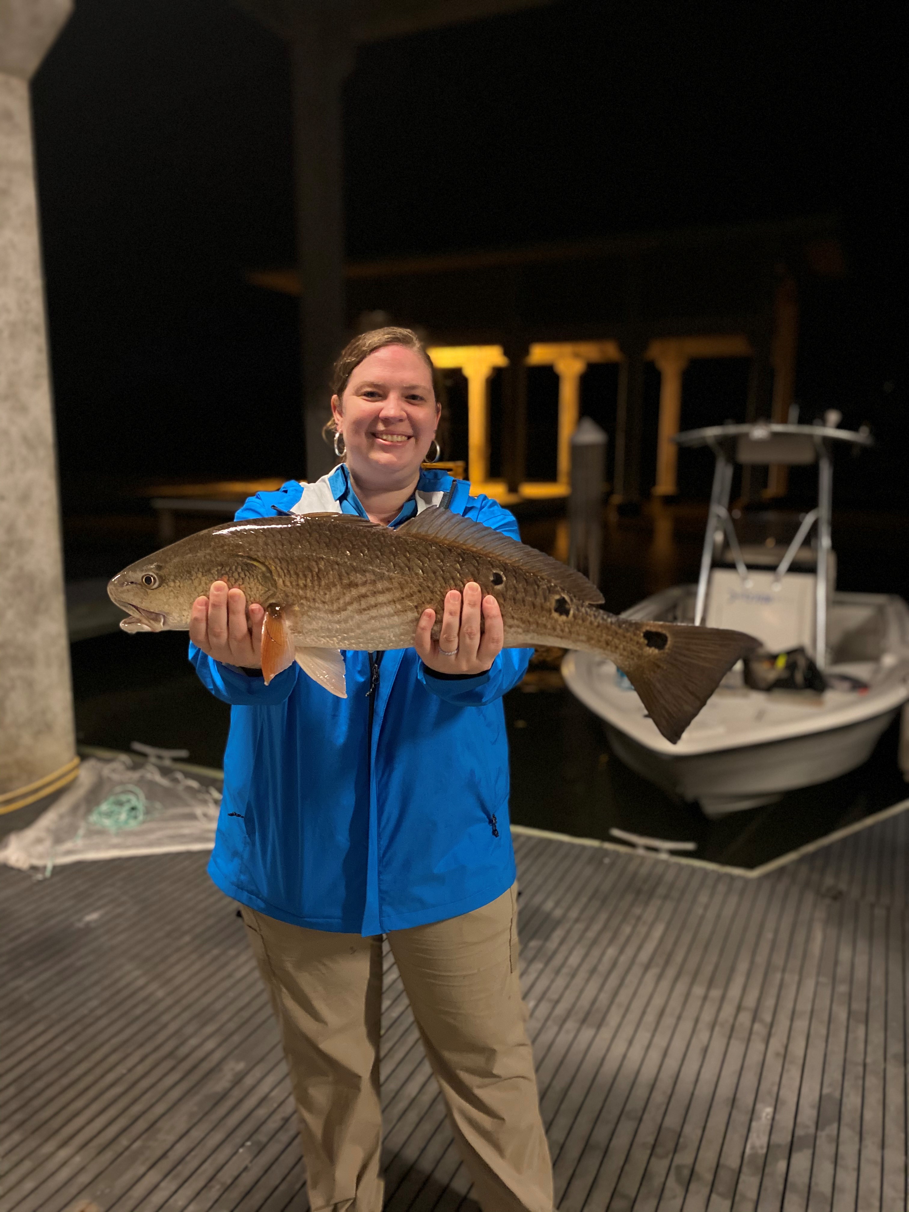Participant shows off her catch after learning new skills at 2020 Women's Fishing Workshop