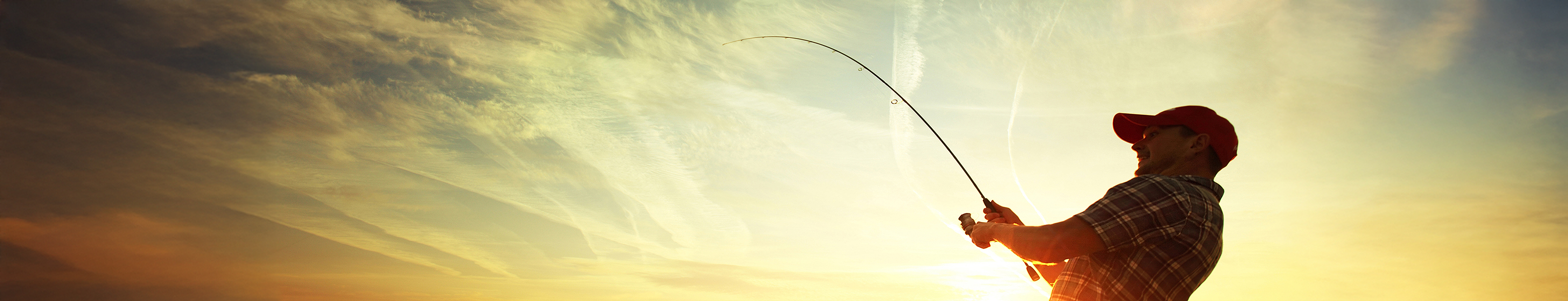 image of an angler fishing at sunrise
