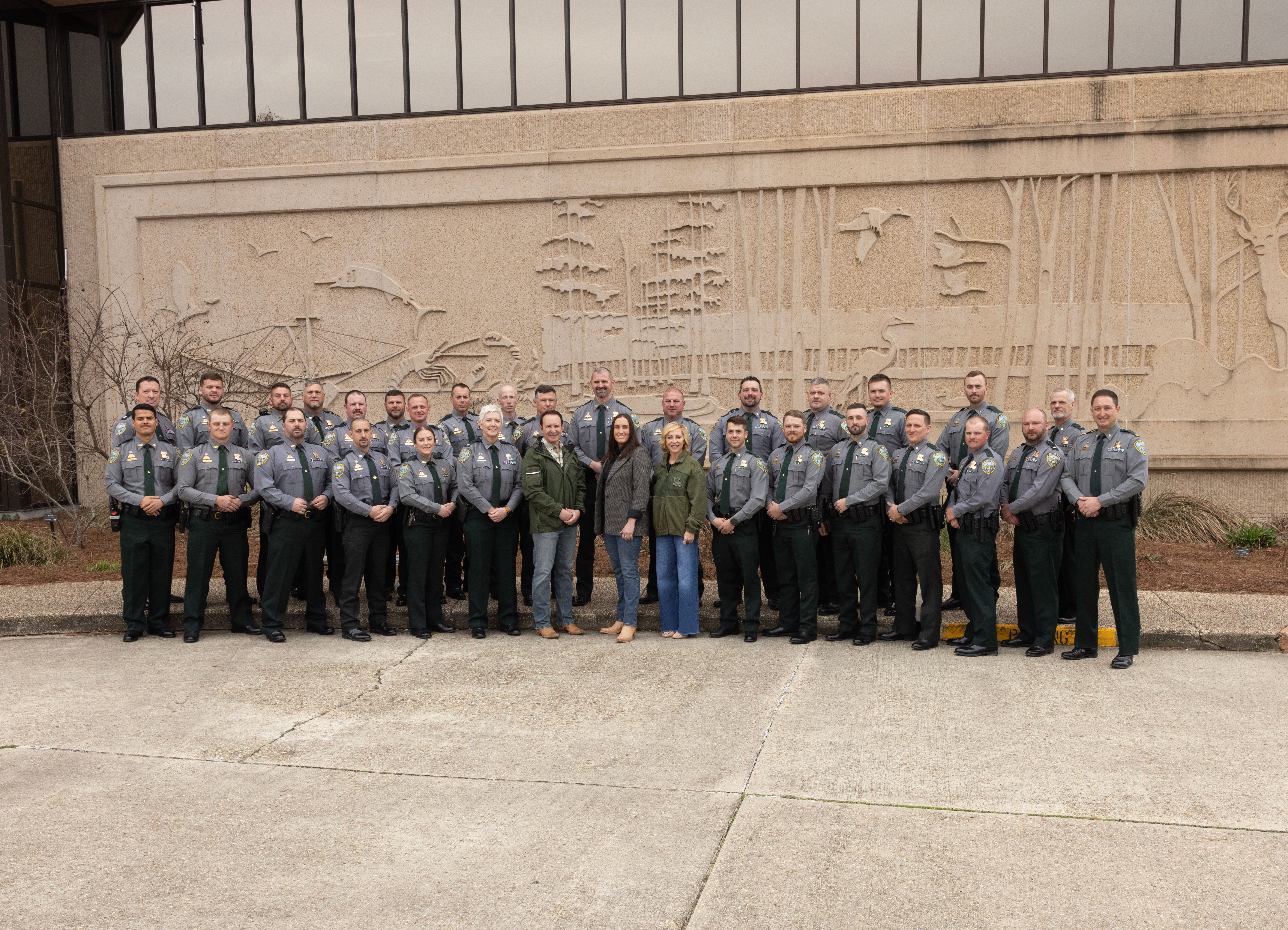 Gov. Landry, LDWF Secretary Madison Sheahan and First Lady Sharon Landry (middle front) with agents from the Alexandria Office Region and Col. Rachel Zechenelly (left of the Governor) and Lt. Col. Travis Huval (far left back row). The Governor, LDWF Secretary and First Lady took group photos with every LDWF Enforcement Division Region Office in the state.