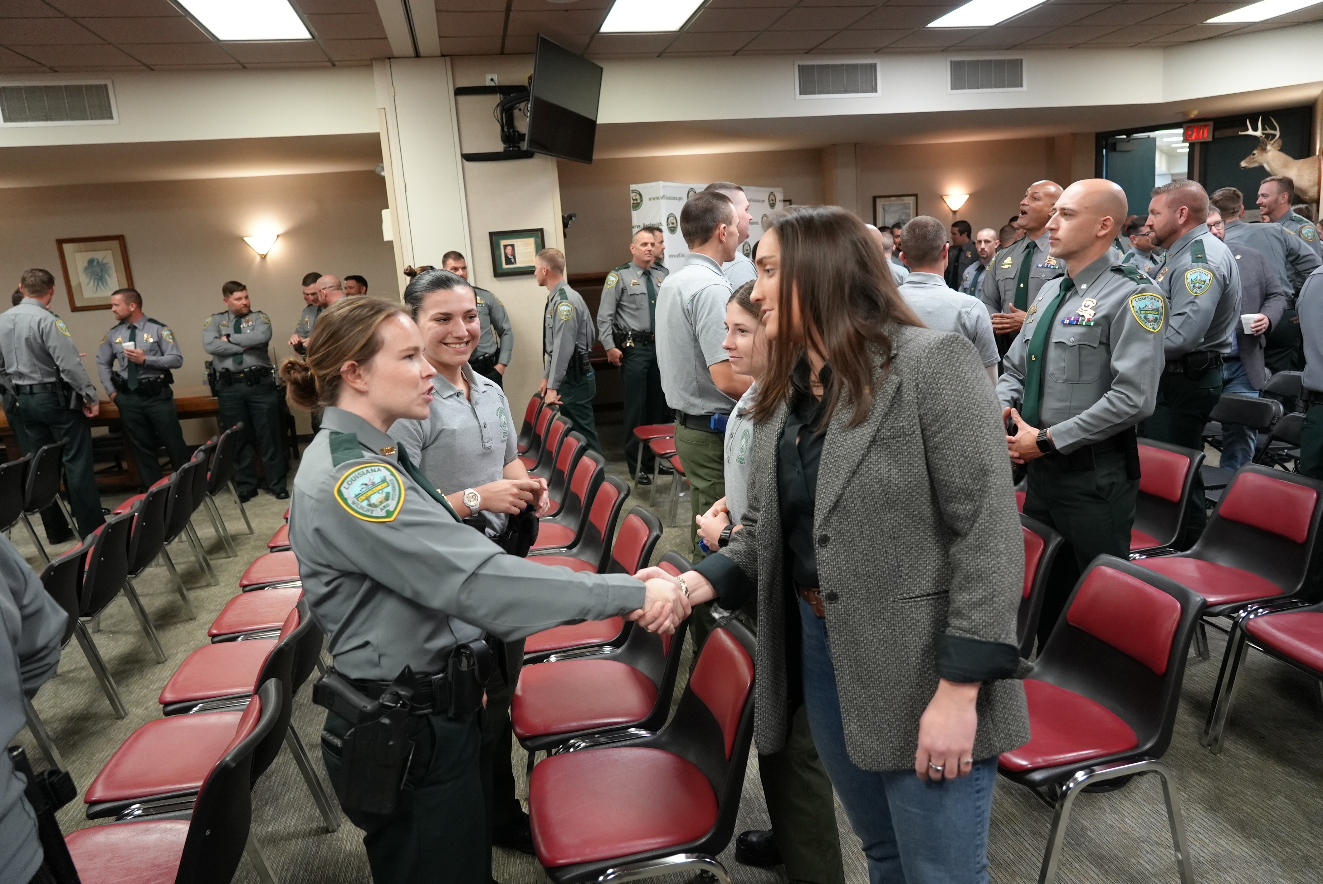 LDWF Secretary Sheahan (right) meeting with agents and current academy cadets.