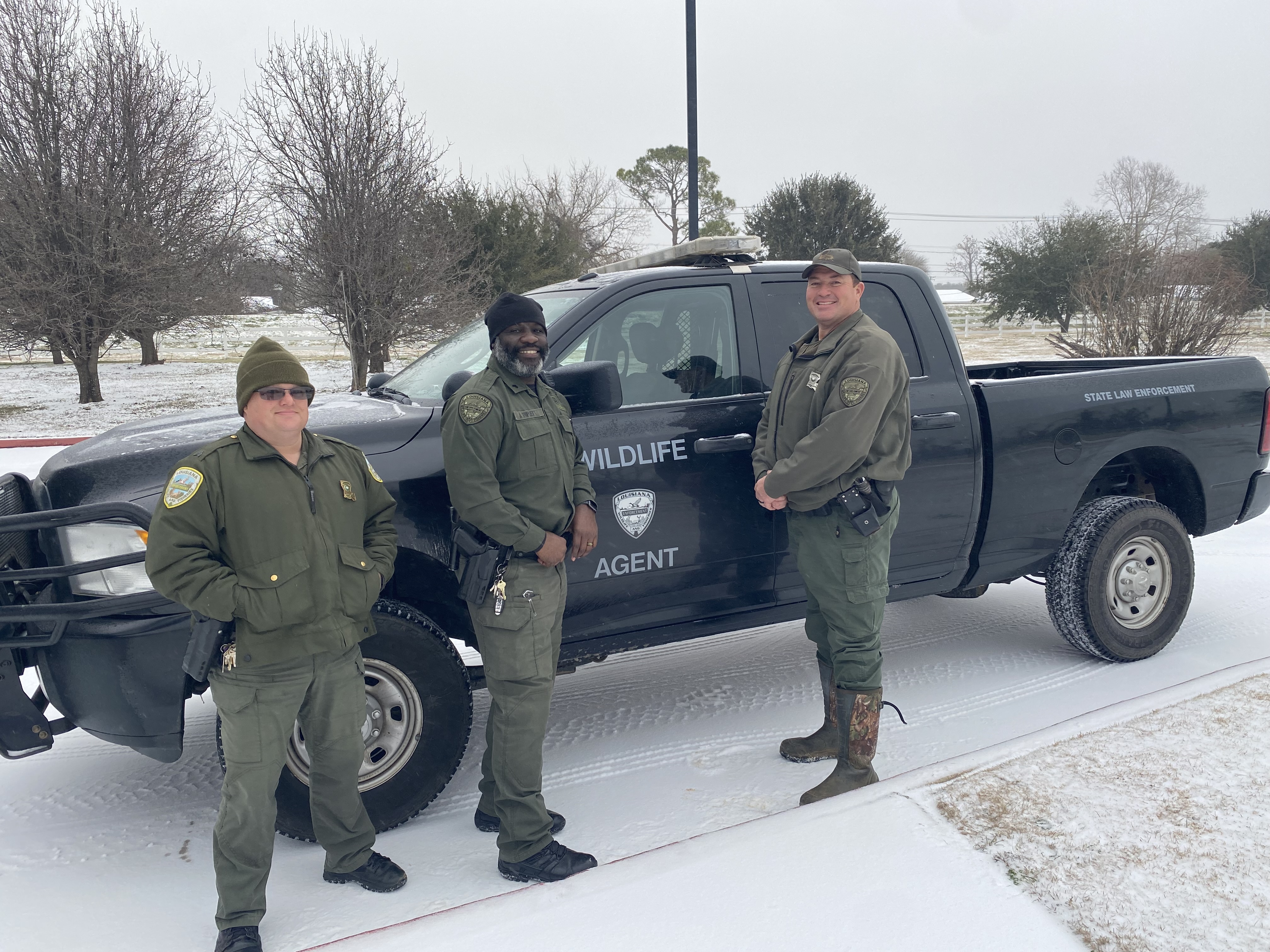 LDWF agents in front of truck in the snow