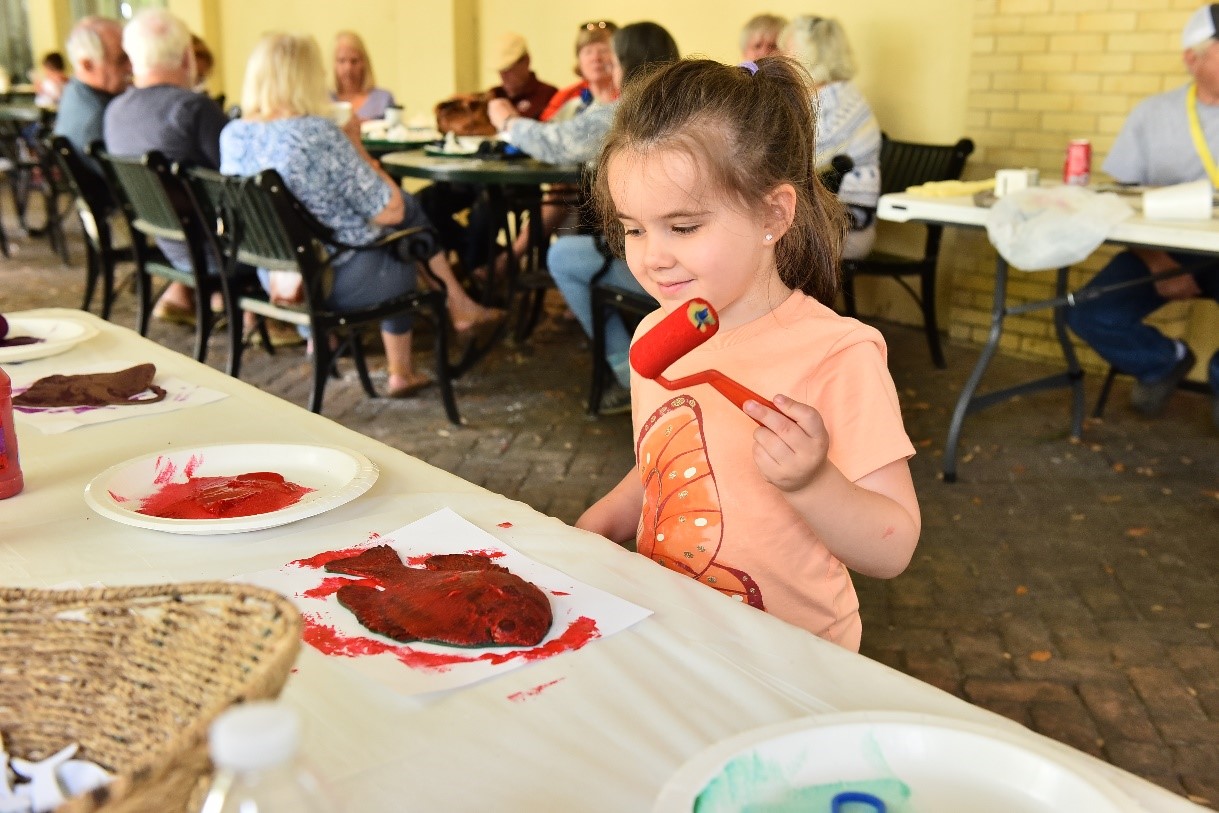 Girl painting fish at BBR