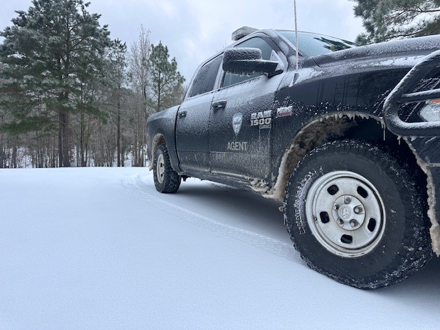 Enforcement Truck on Snowy Road