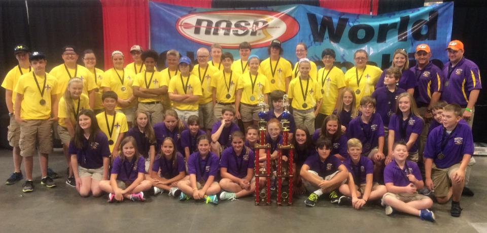 The Benton Elementary and Benton Middle archery teams gather together after both were crowned as 2015 NASP World Champions.