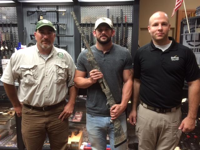Justin Keen (middle) receives his grand prize from Cody Cedotel (left) and Bowie Outfitters Ruffin Moreland.