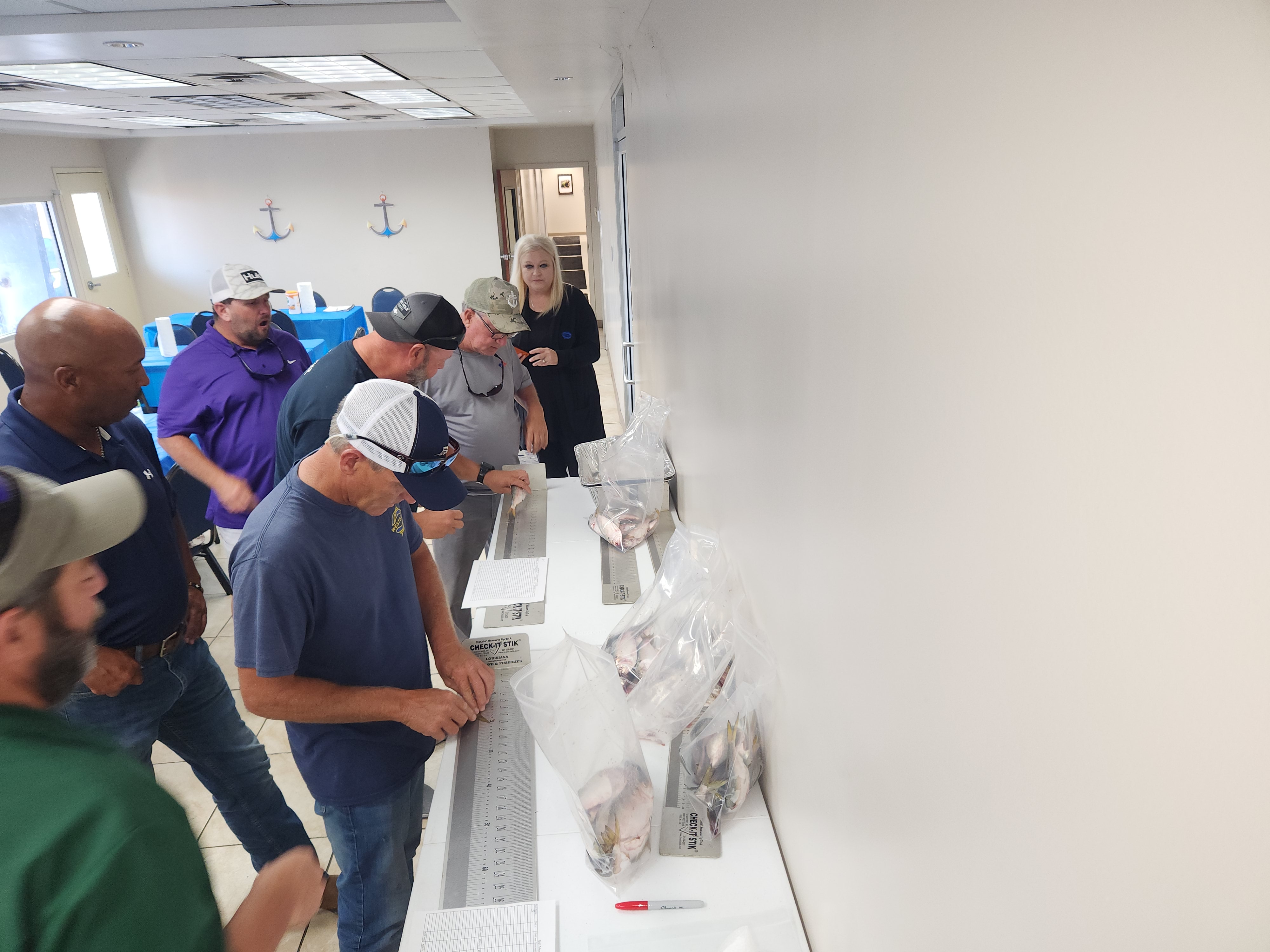 LDWF hosted a training workshop on Sunday, June 25, to train the Daybrook Fisheries Captains to accurately measure menhaden. 