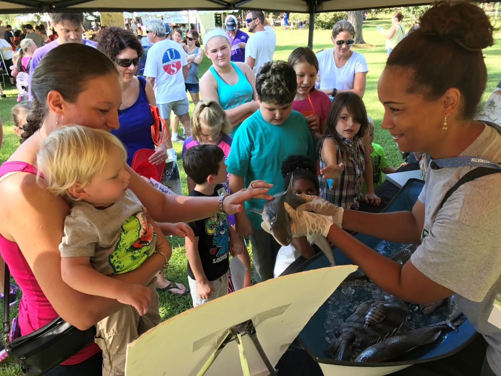 Aquatic Volunteer Instructor, Debrina Baham, teaches members of the public about fish found in Louisiana.