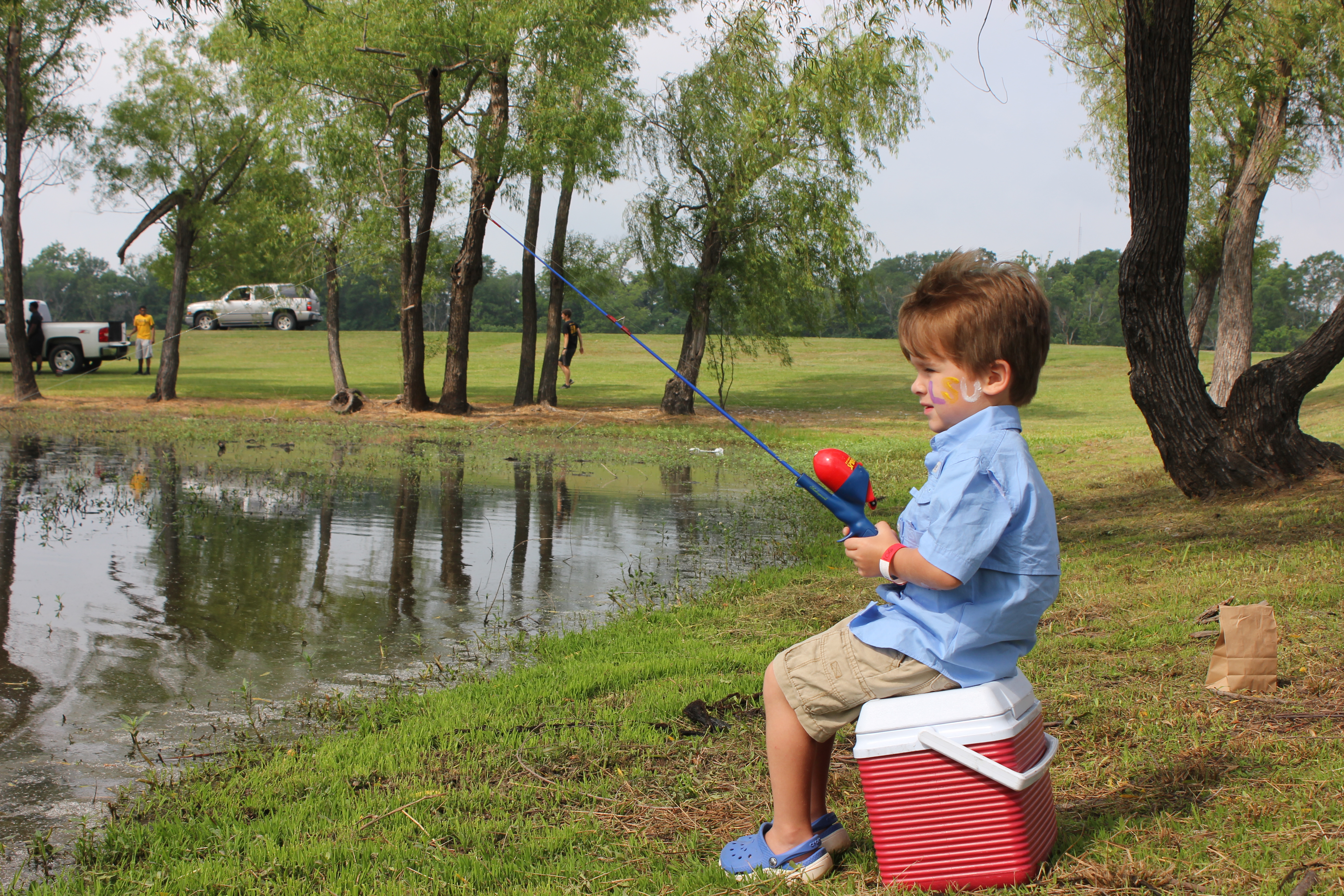 Young boy patiently waiting to catch a fish