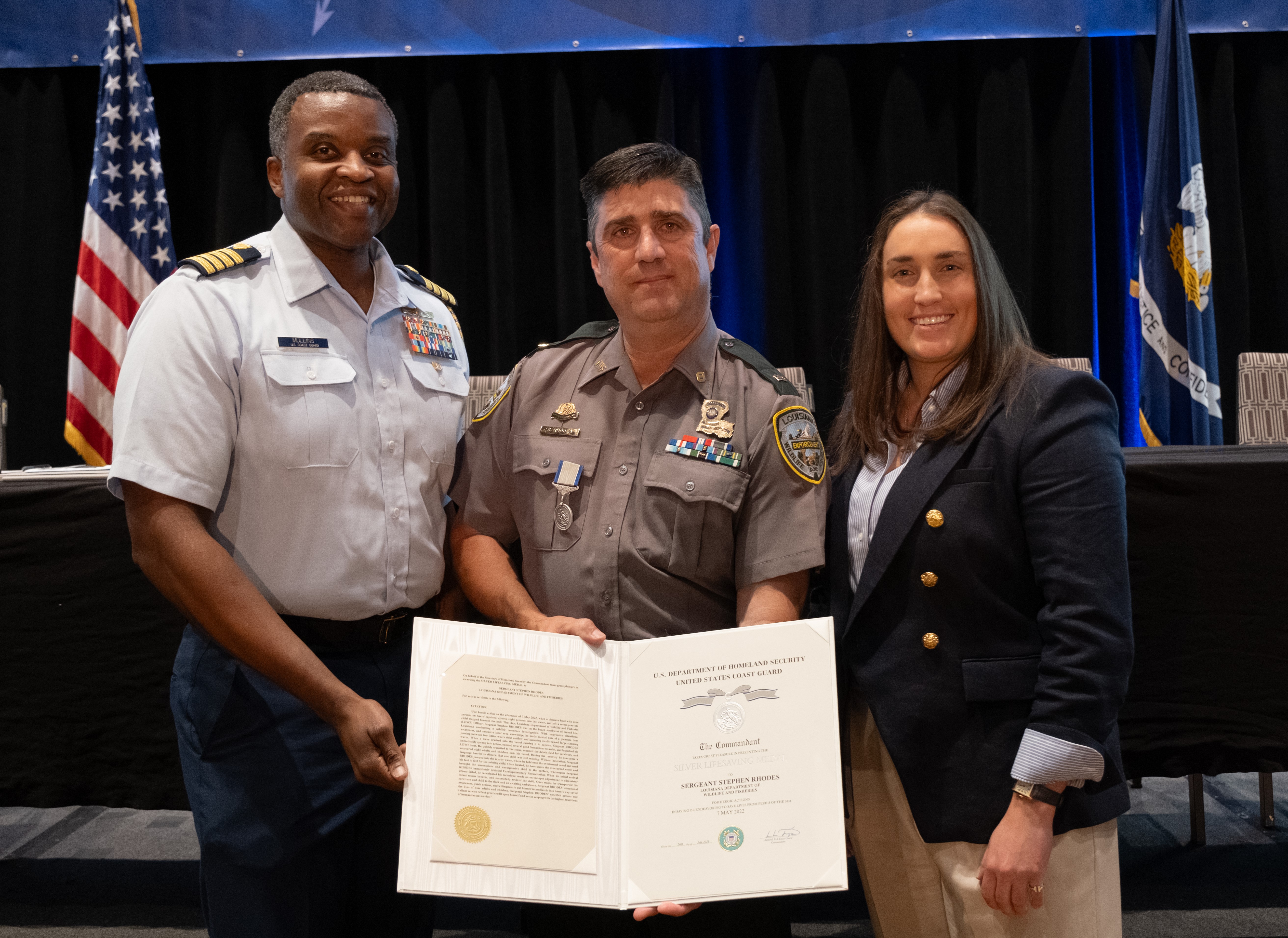 Capt. Ulysses Mullins, Coast Guard Eighth District Chief of Staff, Sgt. Stephen Rhodes and LDWF Secretary Madison Sheahan.