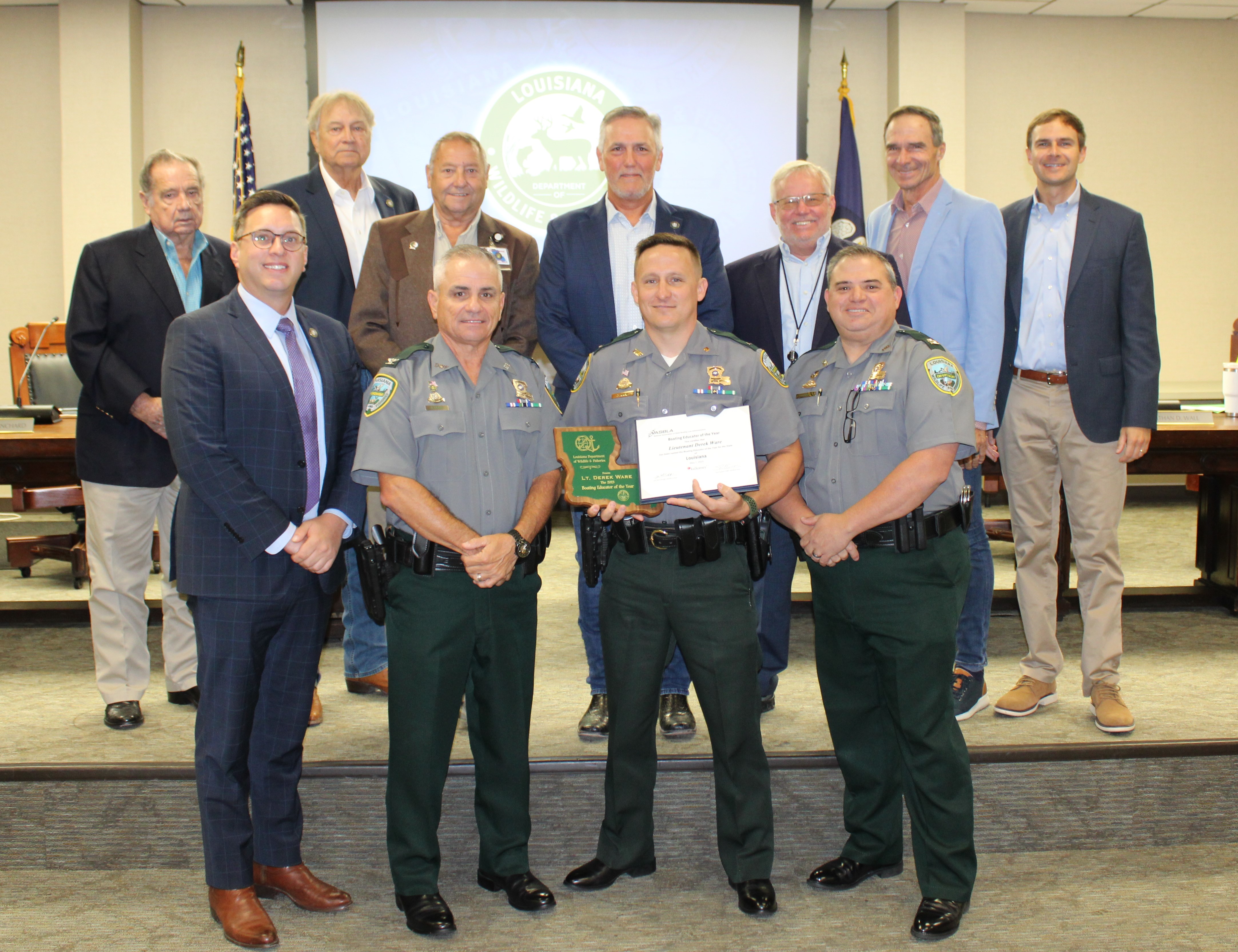 Lt Derek Ware with award and commission members