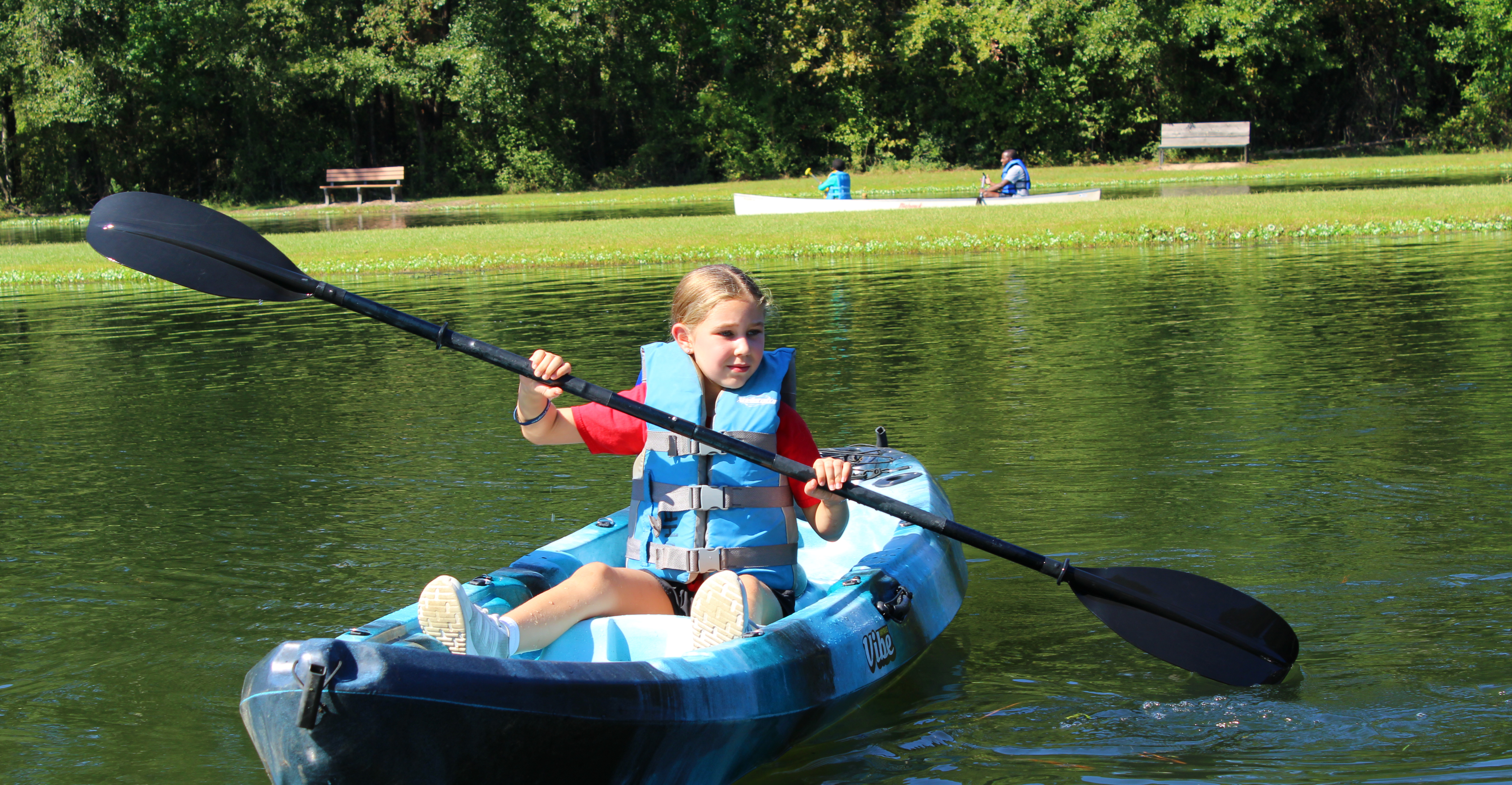 girl in kayak on Waddill pond